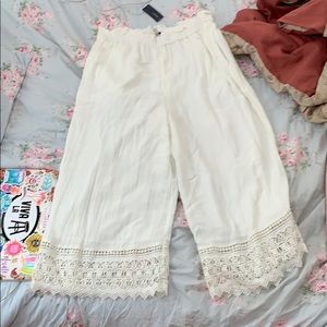Cream flowy pants with crochet detail